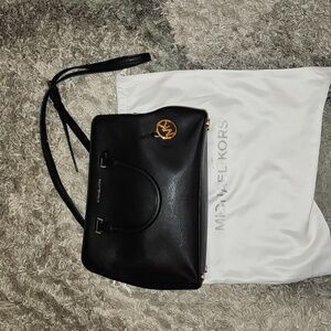 Michael Kors. Black Satchel with shoulder strap.